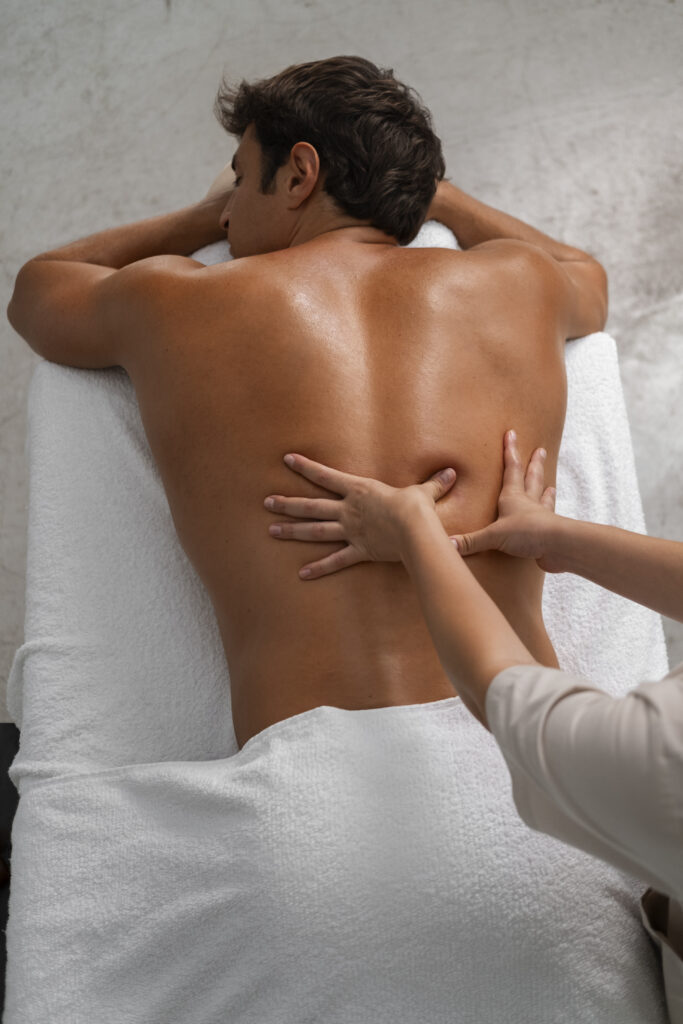 A man receiving a back massage
